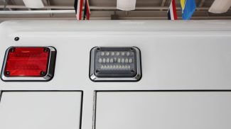 Crestline ambulance rear LED warning and brake lights, featuring a rectangular red lens and a clear LED light for enhanced visibility and safety